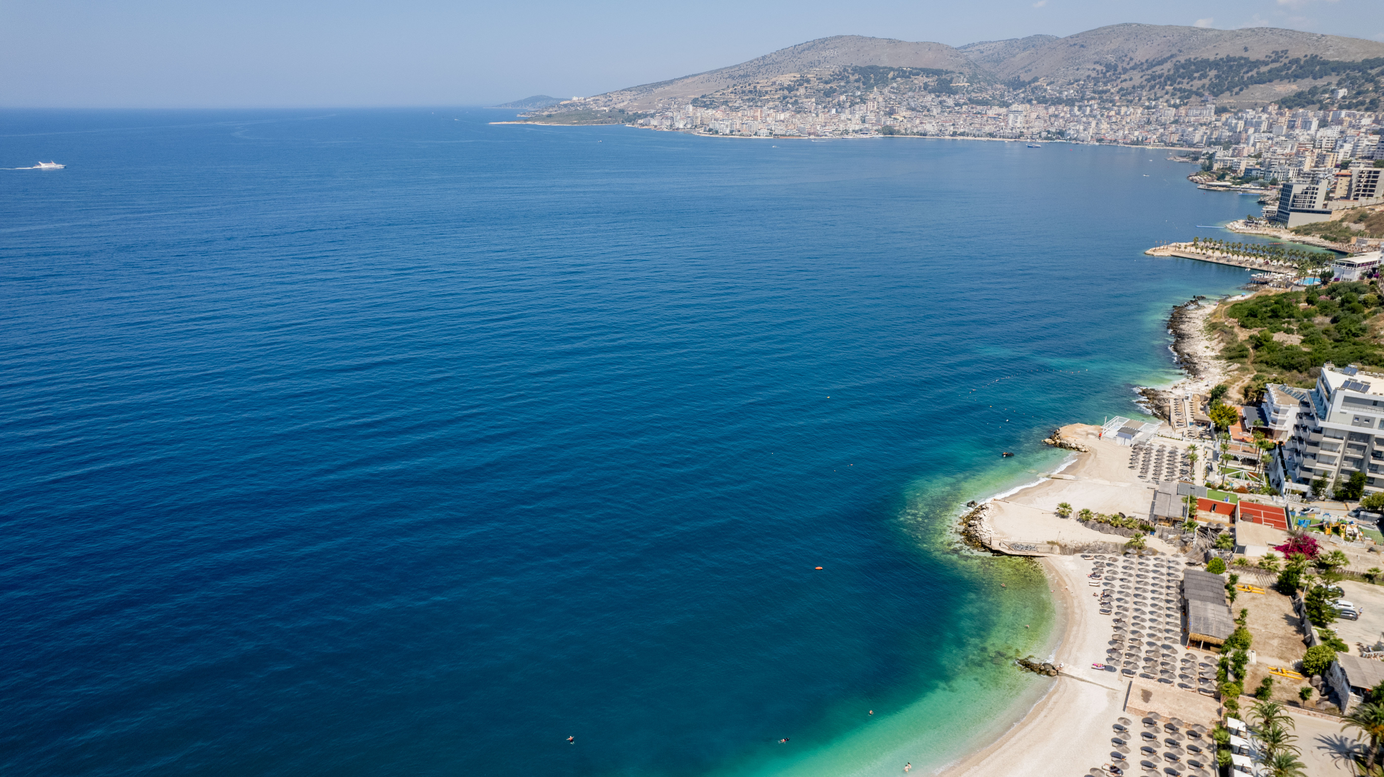 Sarandë seafront promenade at evening with coastal cafés